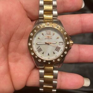 Women’s Invicta gold and silver watch with rose gold accents.